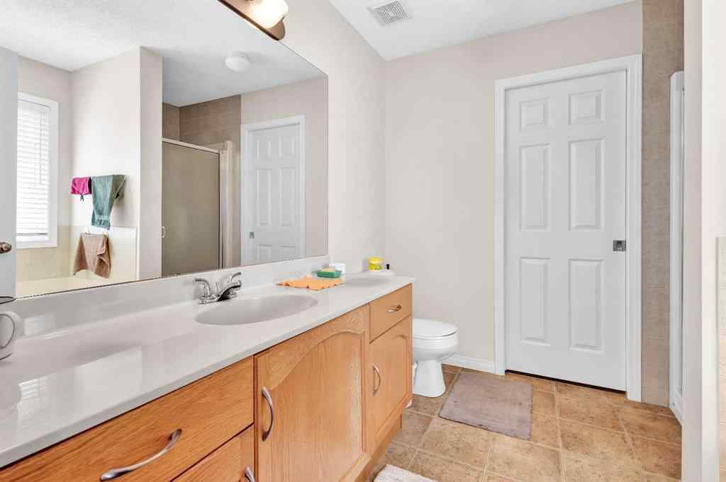 MLS® A2253000 - 156 Saddlecrest Park NE in Saddle Ridge Calgary, Residential