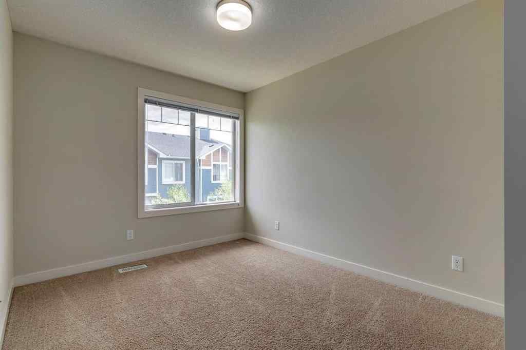 MLS® A2253087 - Unit #165 2802 Kings Heights Gate SE in Ravenswood Airdrie, Residential