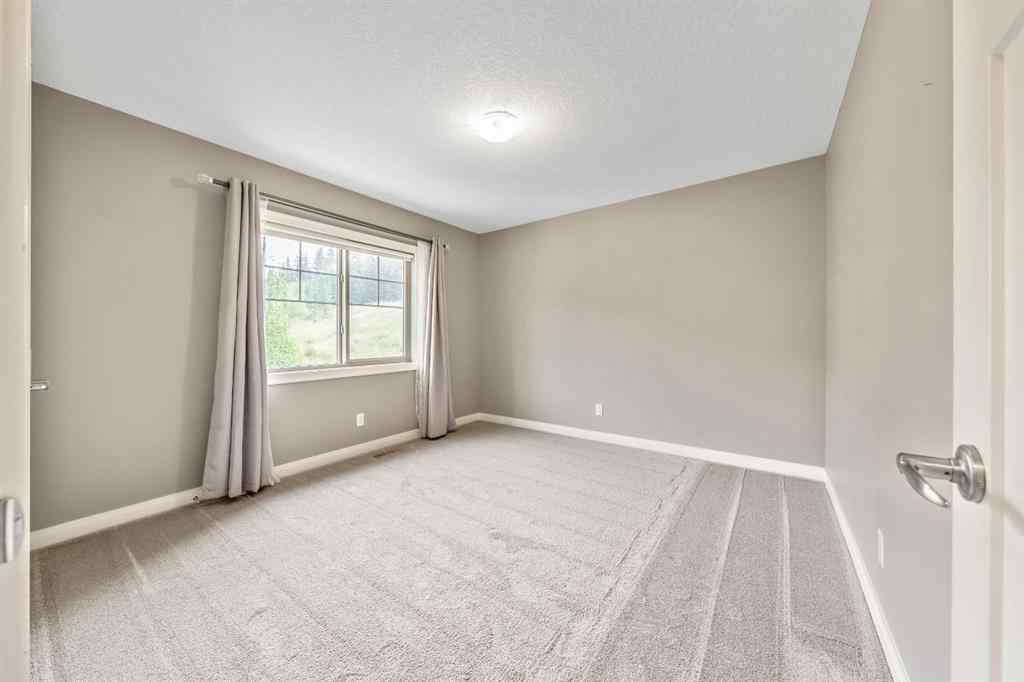 MLS® A2253125 - 21 Riviera Bay  in Riviera Cochrane, Residential