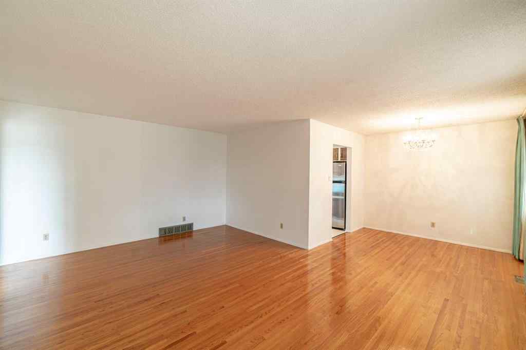 MLS® A2253277 - 1099 Acadia Drive SE in Lake Bonavista Calgary, Residential