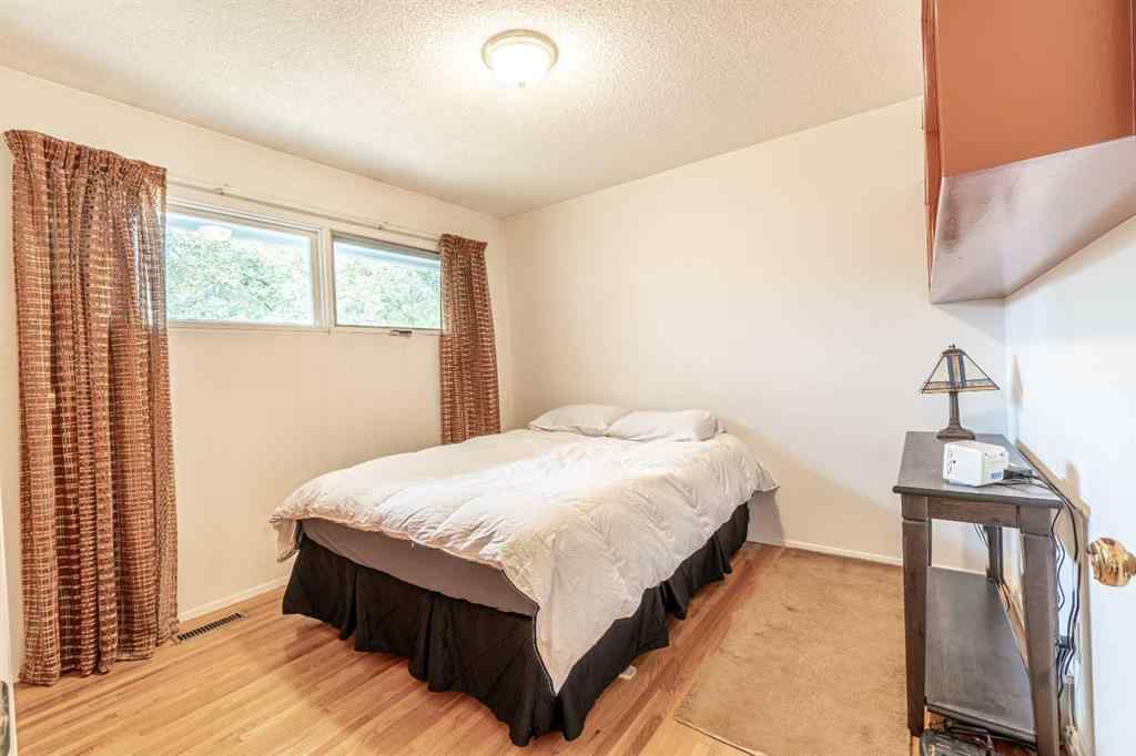 MLS® A2253277 - 1099 Acadia Drive SE in Lake Bonavista Calgary, Residential