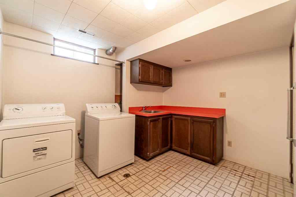 MLS® A2253277 - 1099 Acadia Drive SE in Lake Bonavista Calgary, Residential