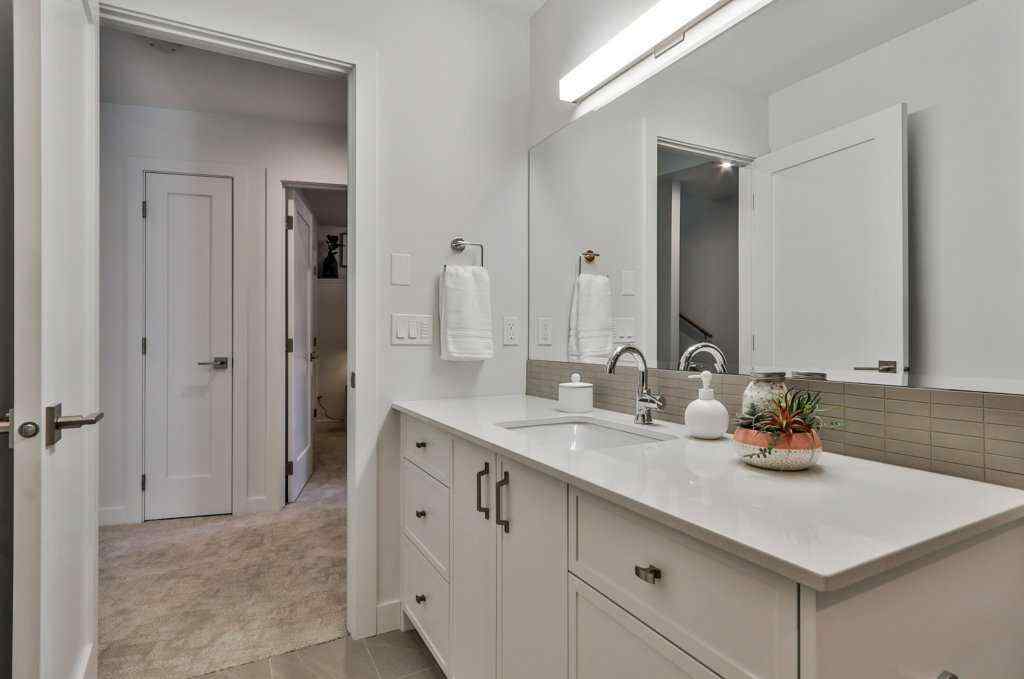 MLS® A2253332 - Unit #202L 209 Stewart Creek Rise  in Three Sisters Canmore, Residential