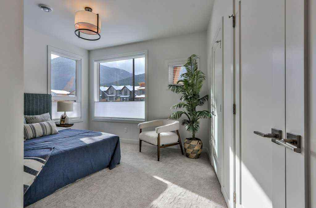 MLS® A2253332 - Unit #202L 209 Stewart Creek Rise  in Three Sisters Canmore, Residential