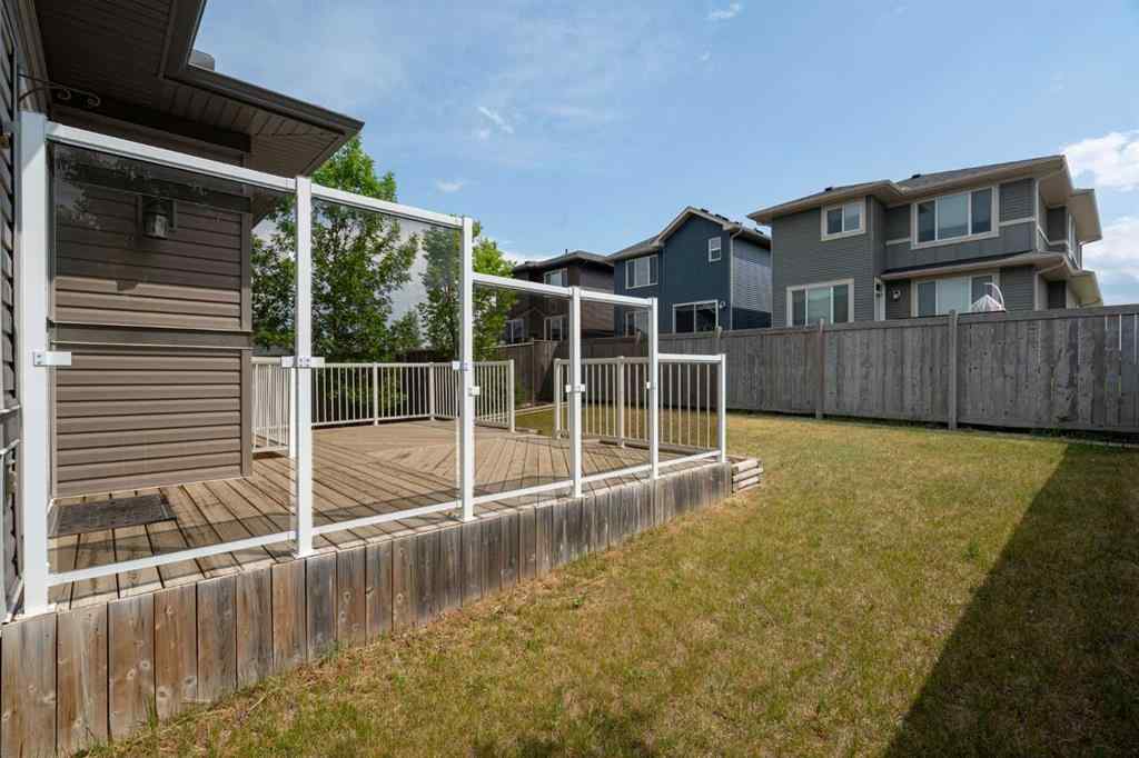 MLS® A2253501 - 1402 Ravenscroft Avenue SE in Ravenswood Airdrie, Residential