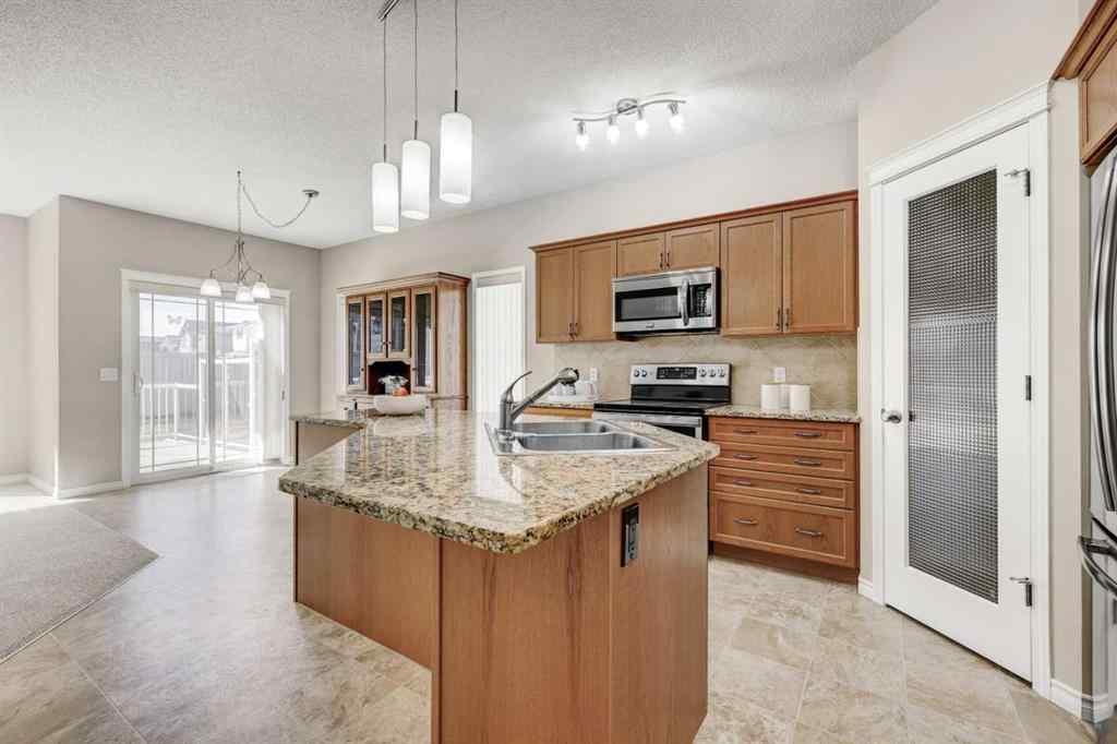 MLS® A2253501 - 1402 Ravenscroft Avenue SE in Ravenswood Airdrie, Residential