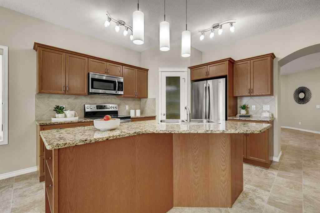 MLS® A2253501 - 1402 Ravenscroft Avenue SE in Ravenswood Airdrie, Residential