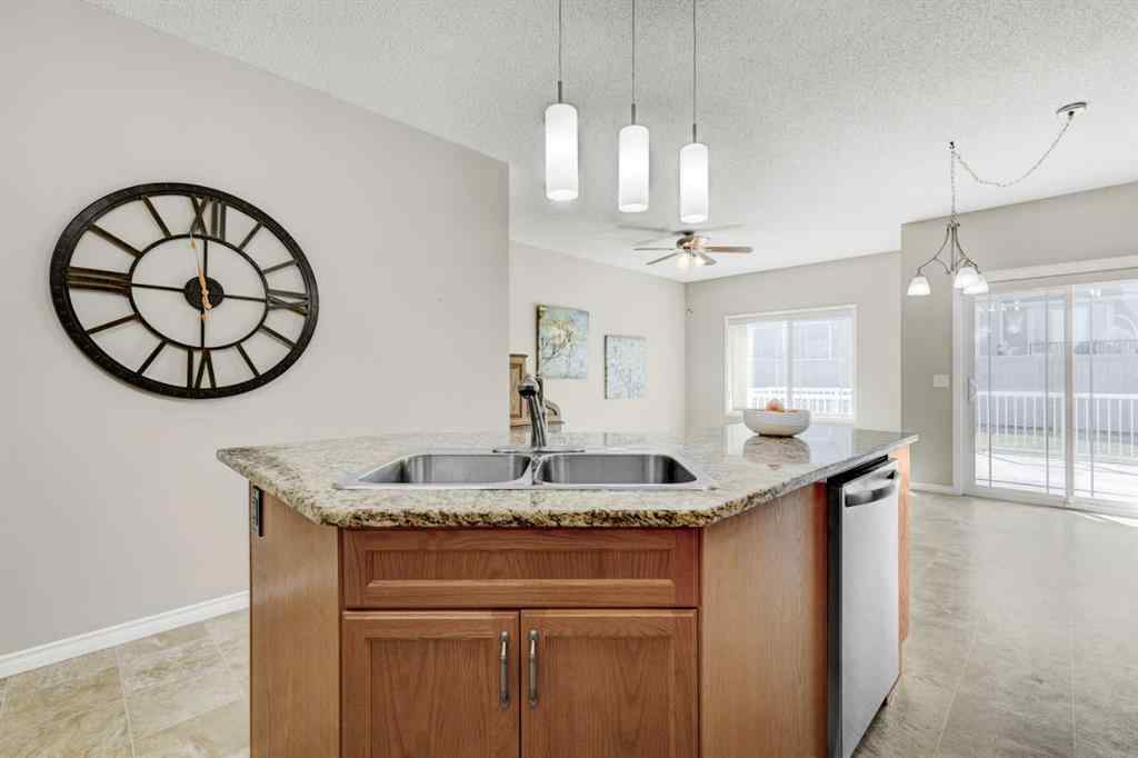 MLS® A2253501 - 1402 Ravenscroft Avenue SE in Ravenswood Airdrie, Residential