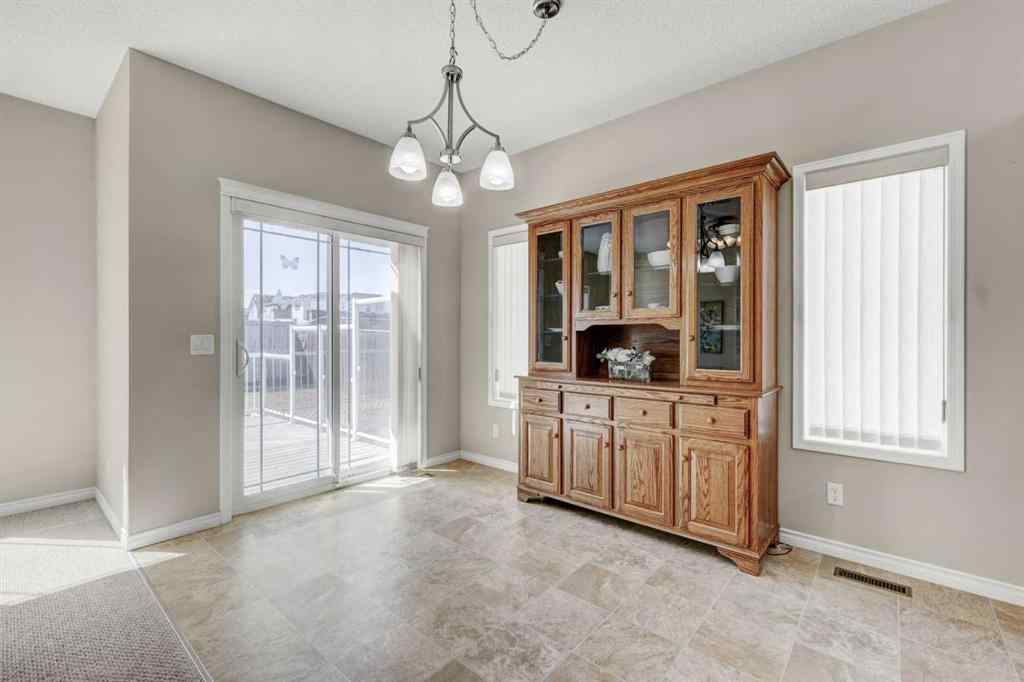MLS® A2253501 - 1402 Ravenscroft Avenue SE in Ravenswood Airdrie, Residential