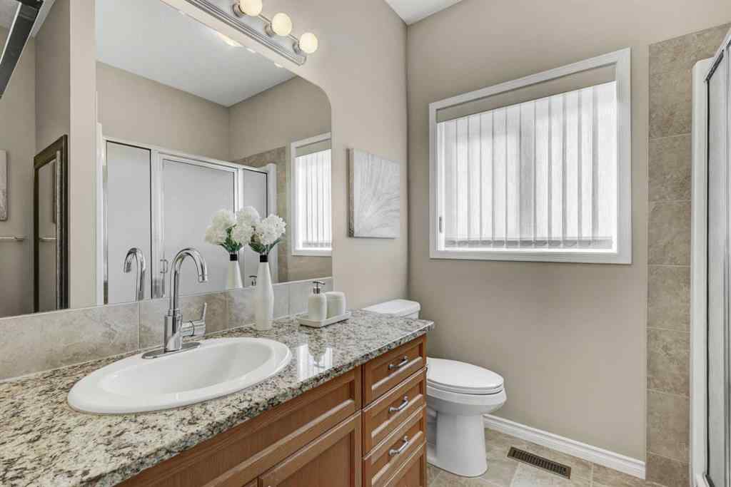 MLS® A2253501 - 1402 Ravenscroft Avenue SE in Ravenswood Airdrie, Residential