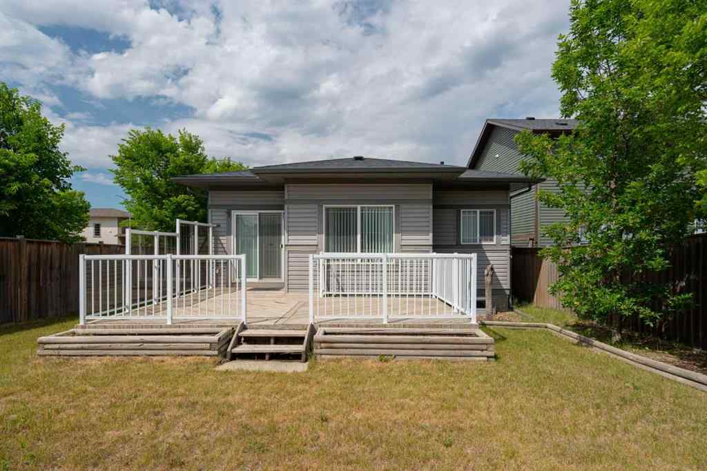 MLS® A2253501 - 1402 Ravenscroft Avenue SE in Ravenswood Airdrie, Residential