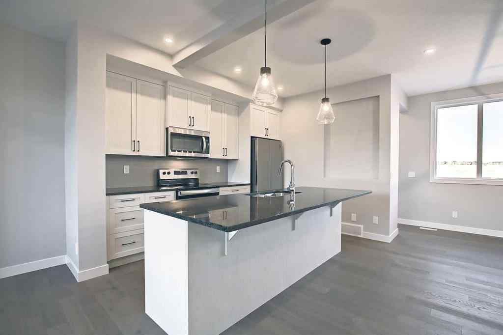MLS® A2253516 - 310 Sundown Road  in Sunset Ridge Cochrane, Residential