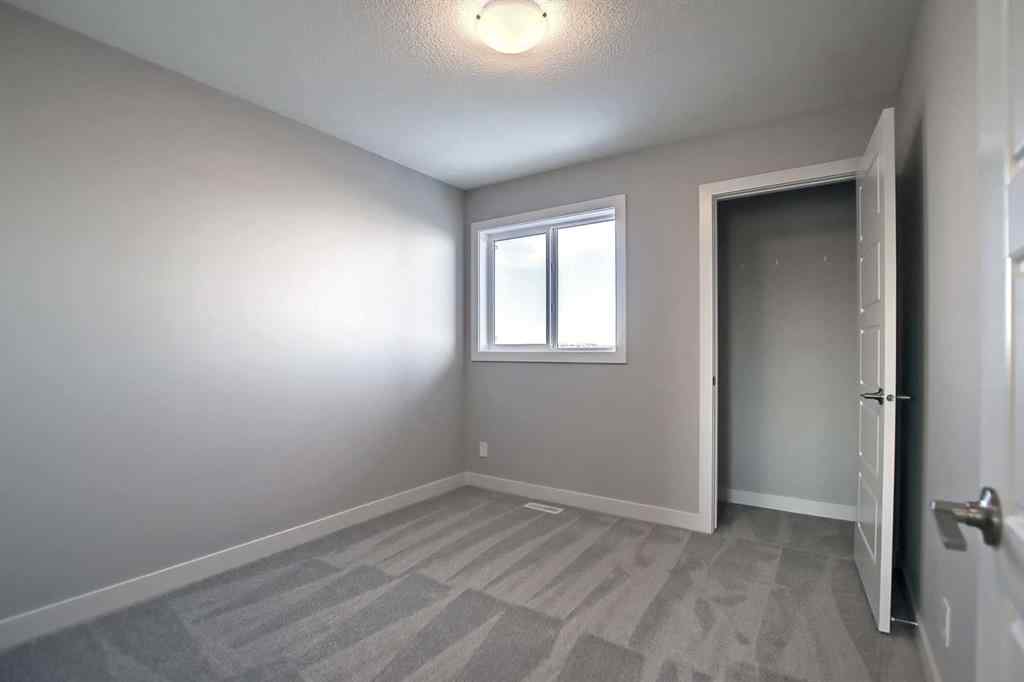 MLS® A2253516 - 310 Sundown Road  in Sunset Ridge Cochrane, Residential