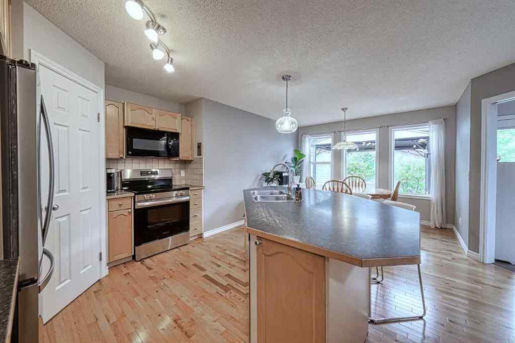 MLS® A2253525 - 144 Eversyde Circle SW in Evergreen Calgary, Residential