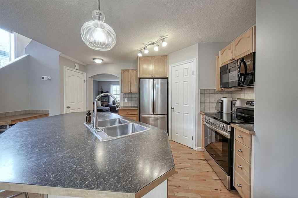 MLS® A2253525 - 144 Eversyde Circle SW in Evergreen Calgary, Residential