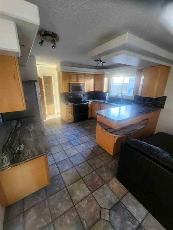 MLS® A2253558 - 9551 85 Avenue  in Highland Park Grande Prairie, Residential