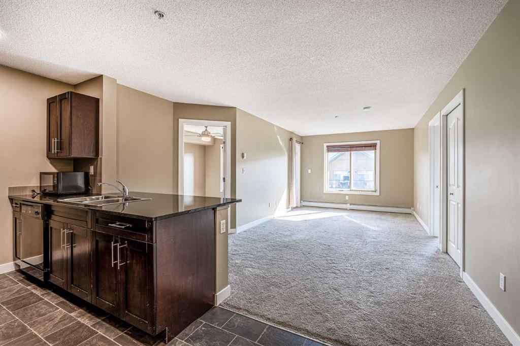 MLS® A2253595 - Unit #1407 403 Mackenzie Way SW in Downtown Airdrie, Residential