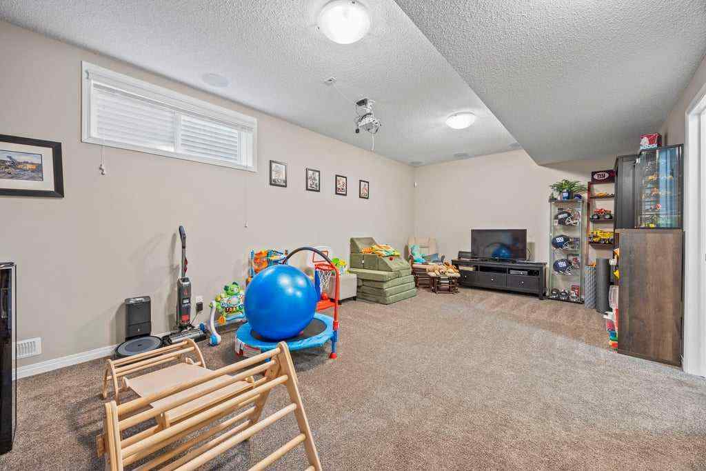 MLS® A2253650 - 512 River Heights Green  in River Song Cochrane, Residential