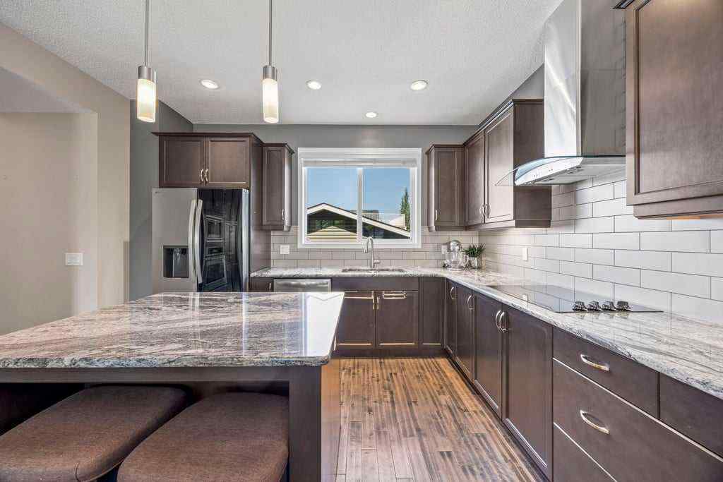 MLS® A2253650 - 512 River Heights Green  in River Song Cochrane, Residential
