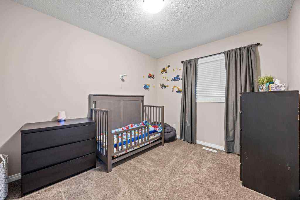 MLS® A2253650 - 512 River Heights Green  in River Song Cochrane, Residential