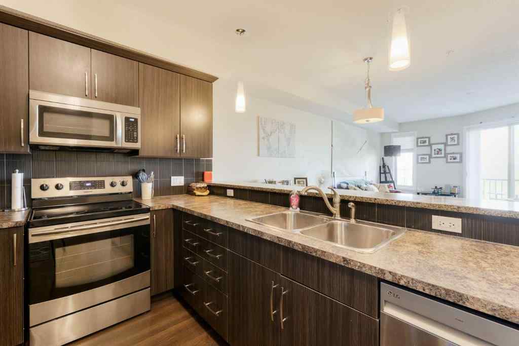 MLS® A2253678 - Unit #2105 15 Sunset Square  in Sunset Ridge Cochrane, Residential