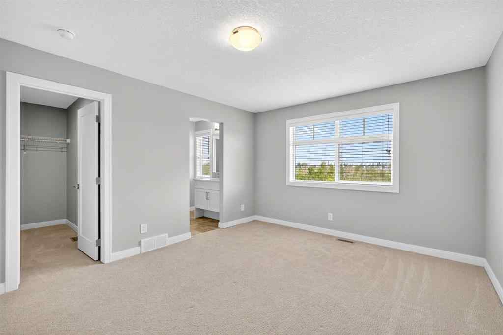 MLS® A2253921 - 405 Wentworth Row SW in West Springs Calgary, Residential