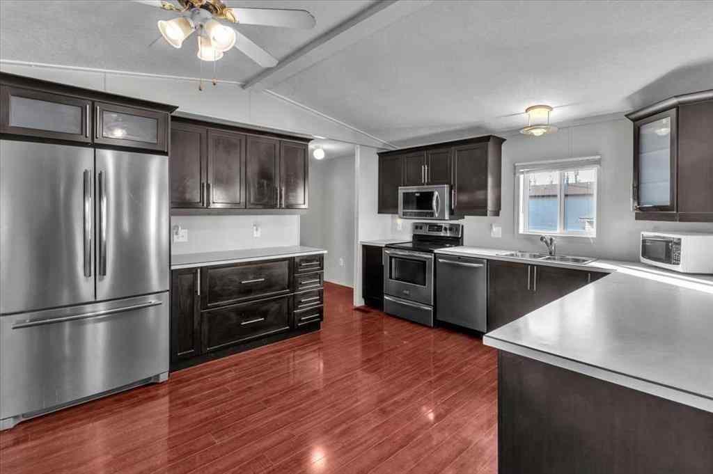 MLS® A2253934 - 294 Burroughs Circle NE in Montgomery Calgary, Mobile
