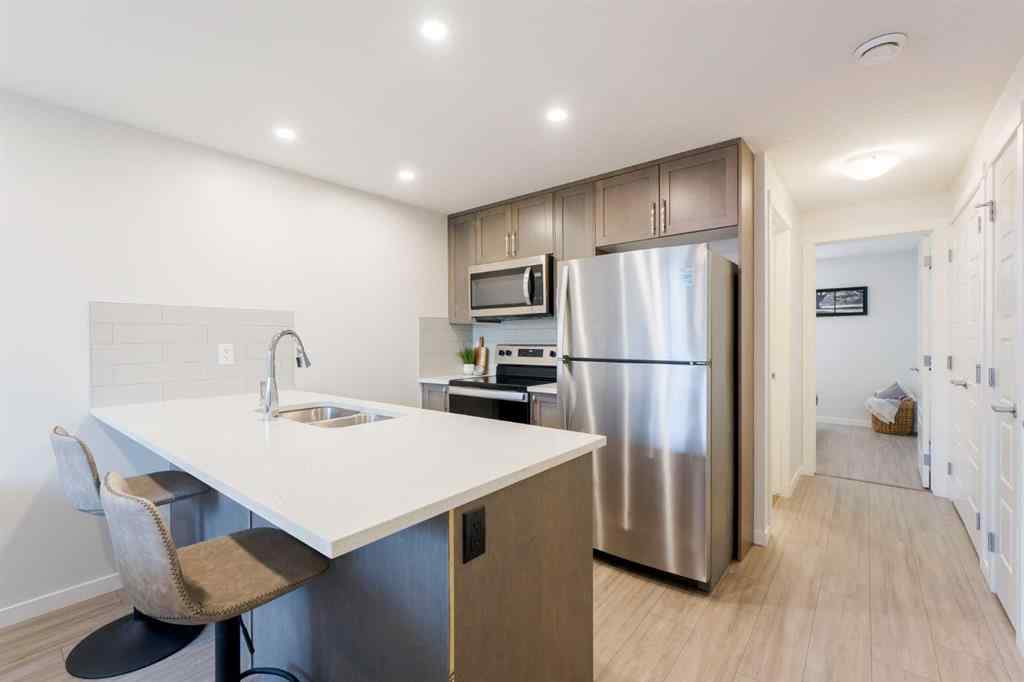 MLS® A2253980 - Unit #104 260 Rowley Way NW in Haskayne Calgary, Residential