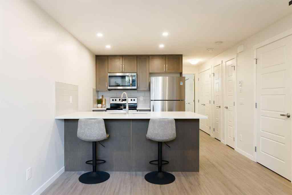 MLS® A2253980 - Unit #104 260 Rowley Way NW in Haskayne Calgary, Residential