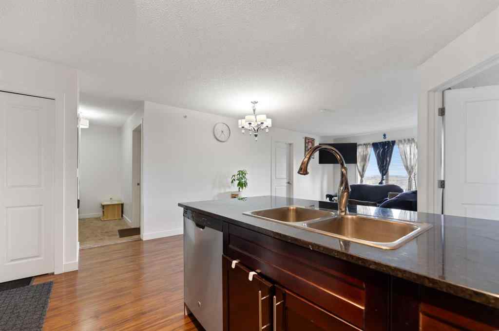 MLS® A2253990 - Unit #411 15 Saddlestone Way NE in Saddle Ridge Calgary, Residential