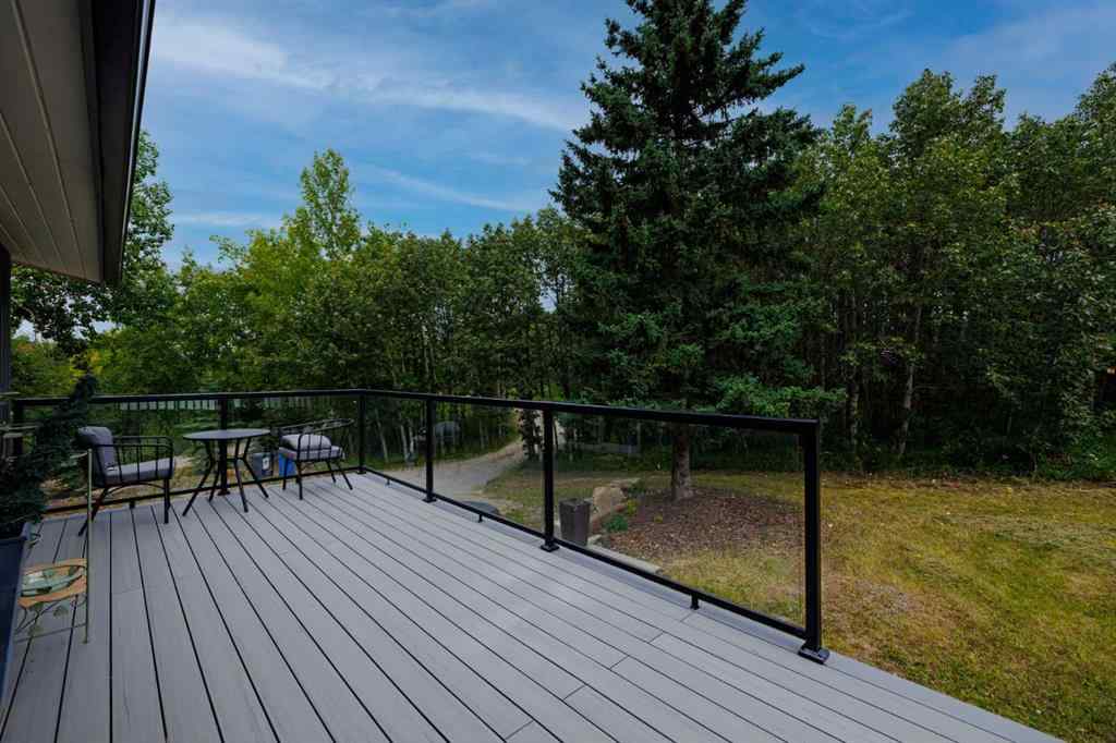 MLS® A2254515 - 65 Woodland Lane  in Bearspaw_Calg Rural Rocky View County, Residential