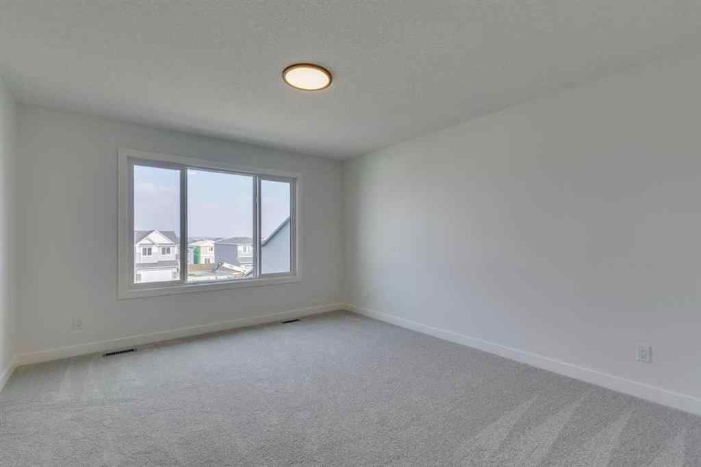 MLS® A2254589 - 104 Amblefield Grove NW in Moraine Calgary, Residential