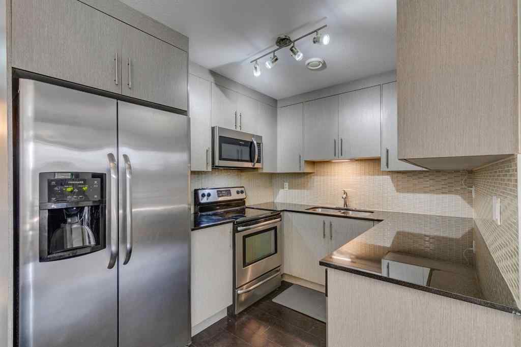 MLS® A2254800 - Unit #2 43 West Coach Manor SW in West Springs Calgary, Residential
