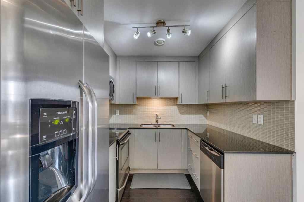 MLS® A2254800 - Unit #2 43 West Coach Manor SW in West Springs Calgary, Residential