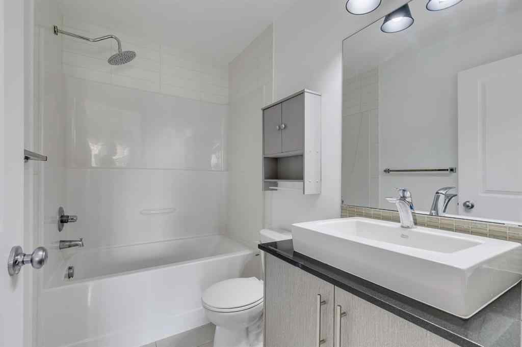 MLS® A2254800 - Unit #2 43 West Coach Manor SW in West Springs Calgary, Residential