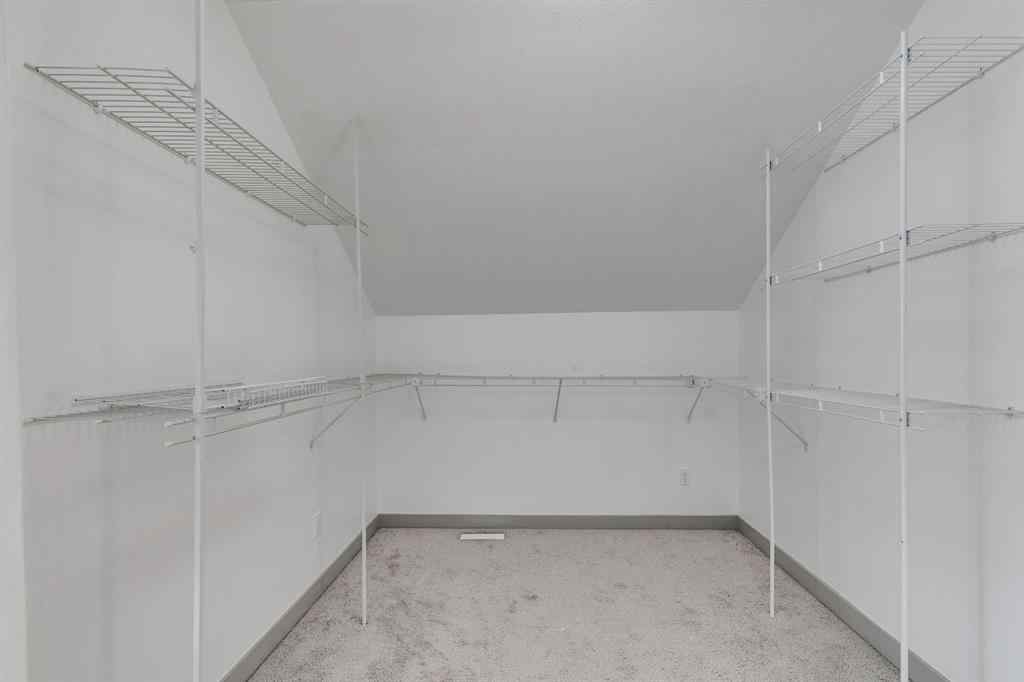 MLS® A2254800 - Unit #2 43 West Coach Manor SW in West Springs Calgary, Residential