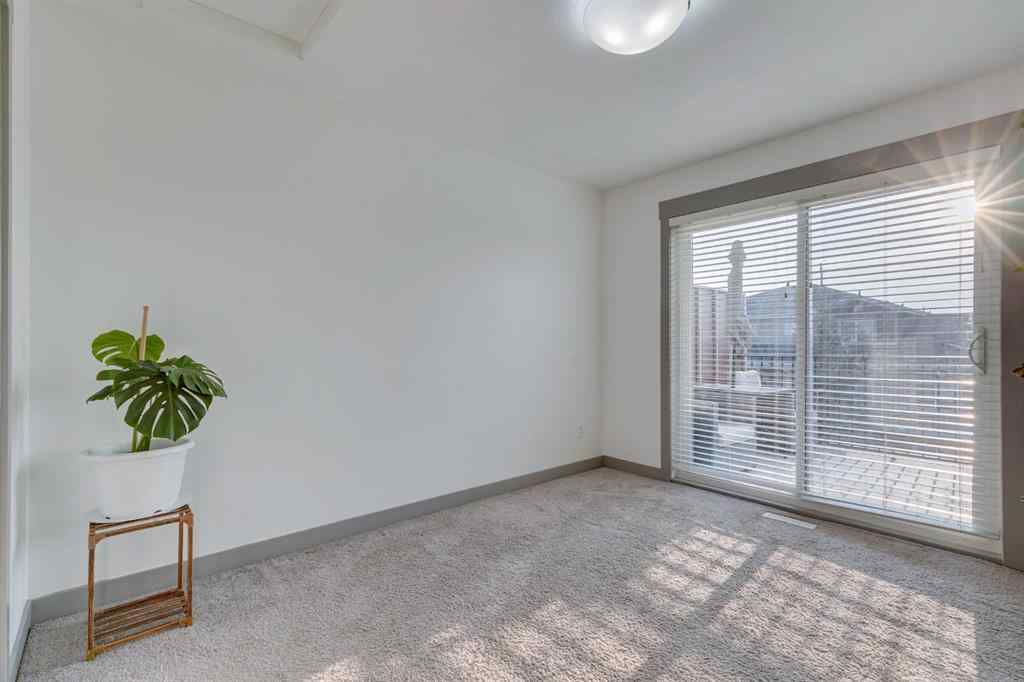 MLS® A2254800 - Unit #2 43 West Coach Manor SW in West Springs Calgary, Residential