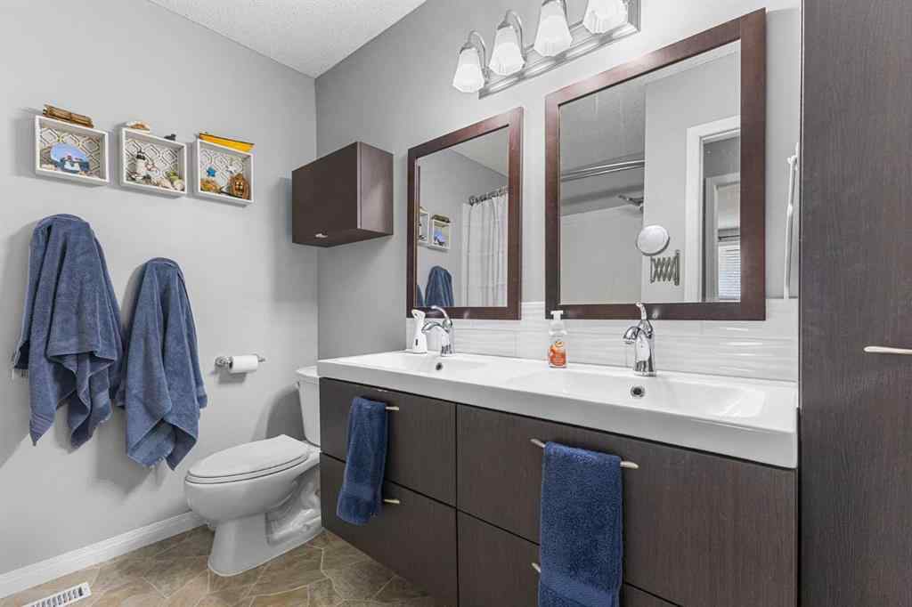 MLS® A2255008 - 67 Woodhill Court SW in Woodlands Calgary, Residential
