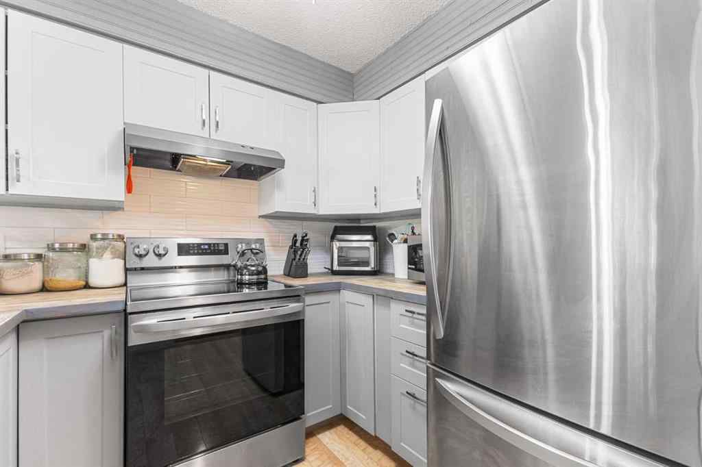MLS® A2255008 - 67 Woodhill Court SW in Woodlands Calgary, Residential