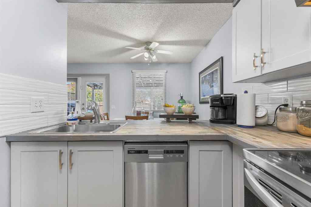 MLS® A2255008 - 67 Woodhill Court SW in Woodlands Calgary, Residential