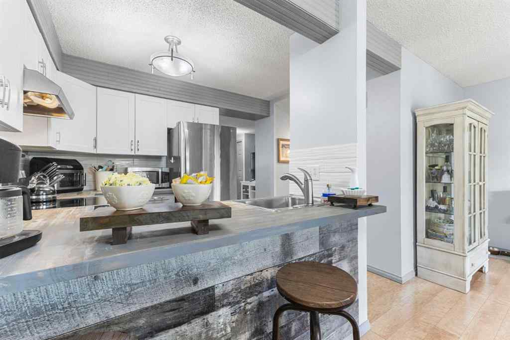 MLS® A2255008 - 67 Woodhill Court SW in Woodlands Calgary, Residential