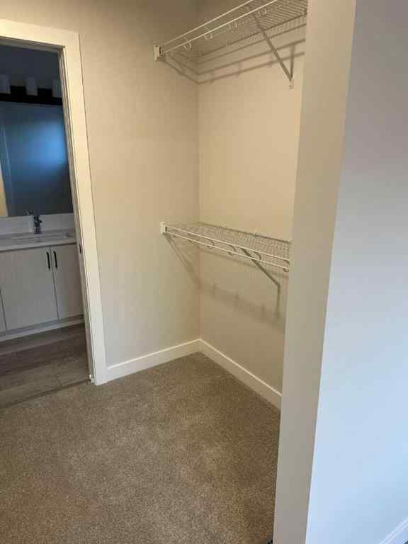 MLS® A2255015 - 105 Tuscany Summit Square NW in Tuscany Calgary, Residential