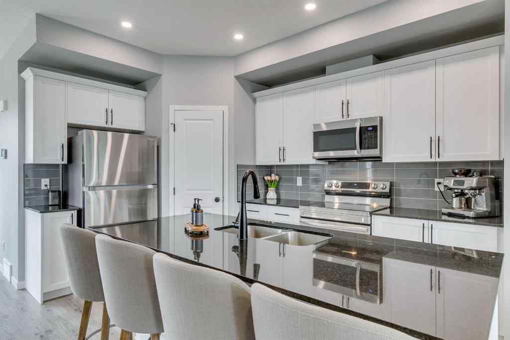 MLS® A2255196 - 63 Wolf Gate  in Wedderburn Okotoks, Residential