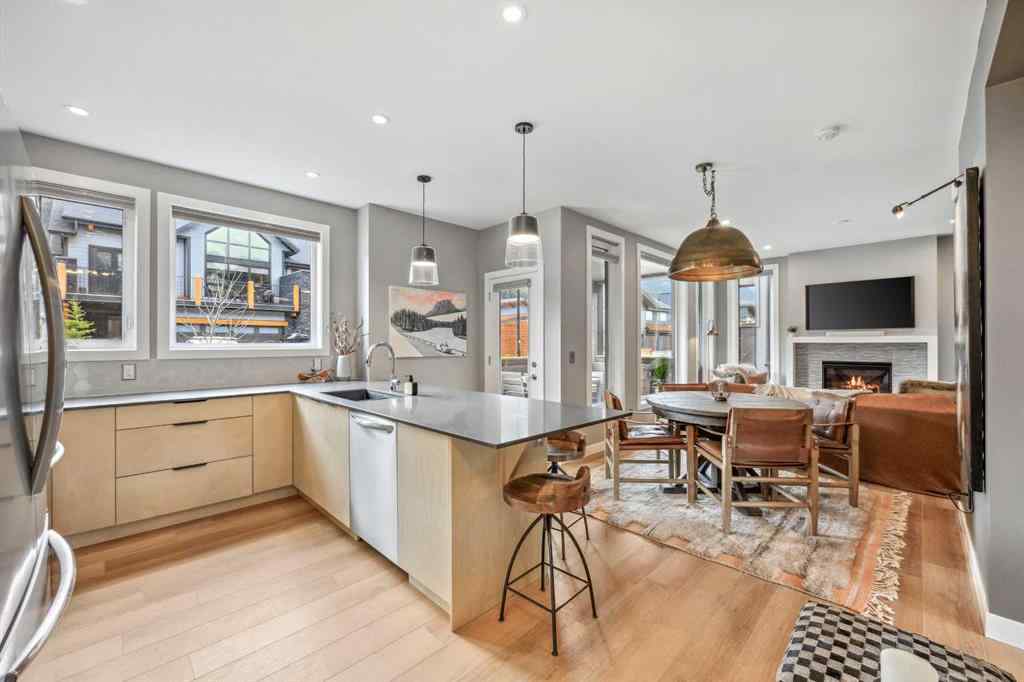 MLS® A2255379 - Unit #201H 209 Stewart Creek Rise  in Three Sisters Canmore, Residential