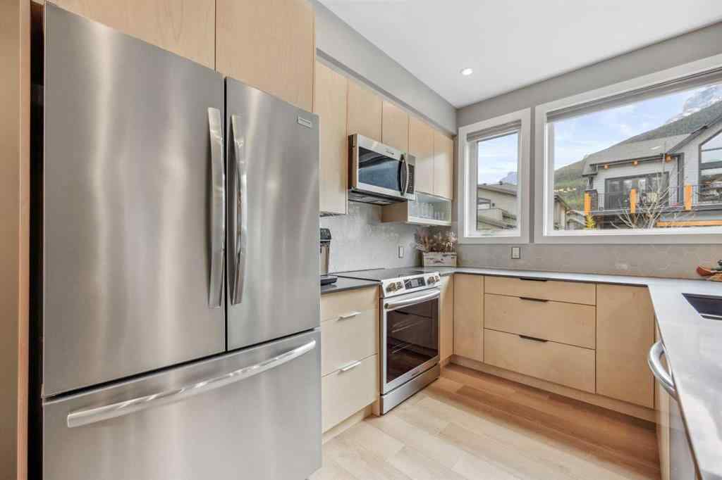 MLS® A2255379 - Unit #201H 209 Stewart Creek Rise  in Three Sisters Canmore, Residential