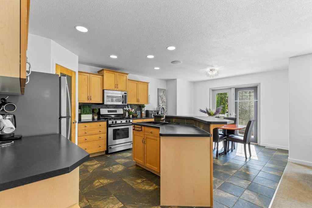 MLS® A2255389 - 57 Everwillow Boulevard SW in Evergreen Calgary, Residential