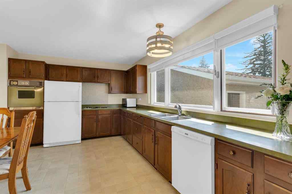 MLS® A2255453 - 64 Lake Emerald Road SE in Lake Bonavista Calgary, Residential
