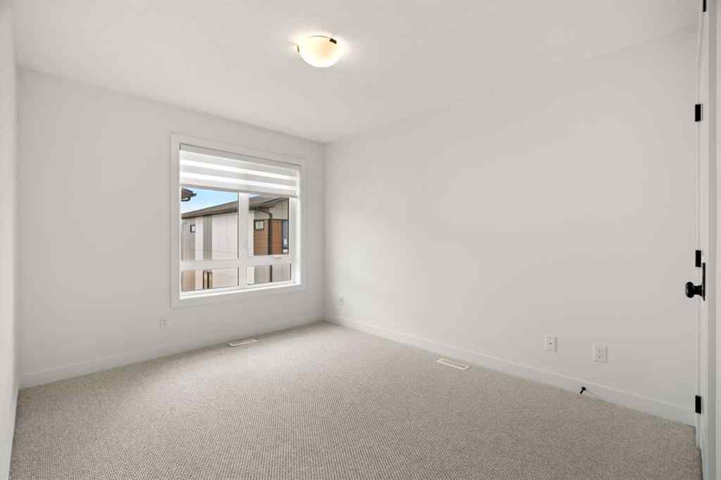 MLS® A2255576 - 8349 8 Avenue SW in West Springs Calgary, Residential