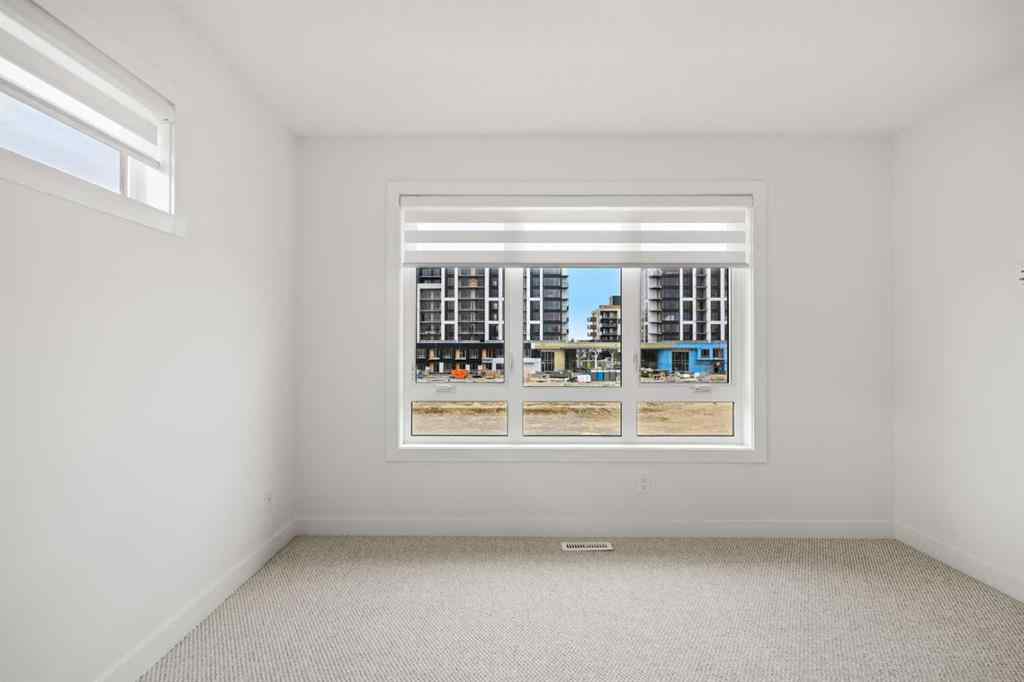 MLS® A2255576 - 8349 8 Avenue SW in West Springs Calgary, Residential