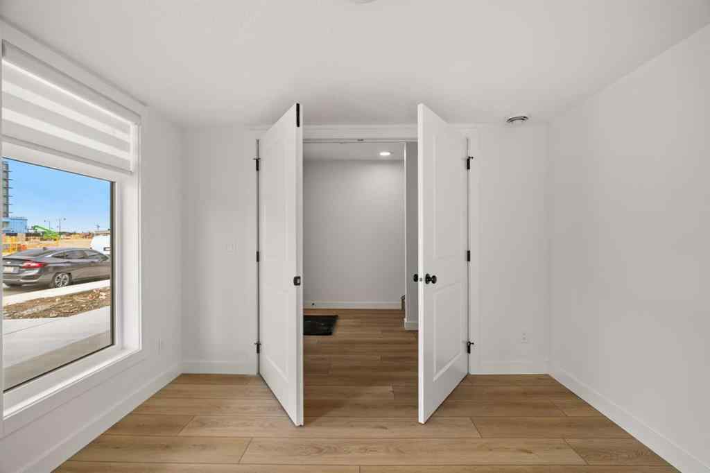 MLS® A2255576 - 8349 8 Avenue SW in West Springs Calgary, Residential